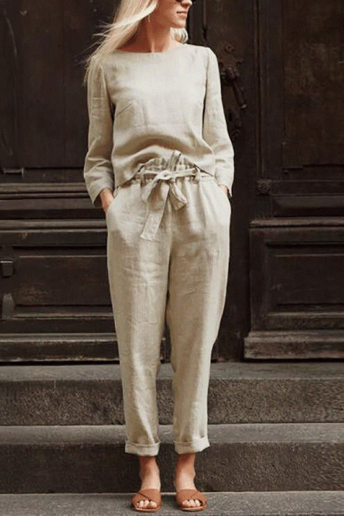 Woman wearing a beige 100 cotton linen monochrome two-piece set with long sleeves and drawstring pants