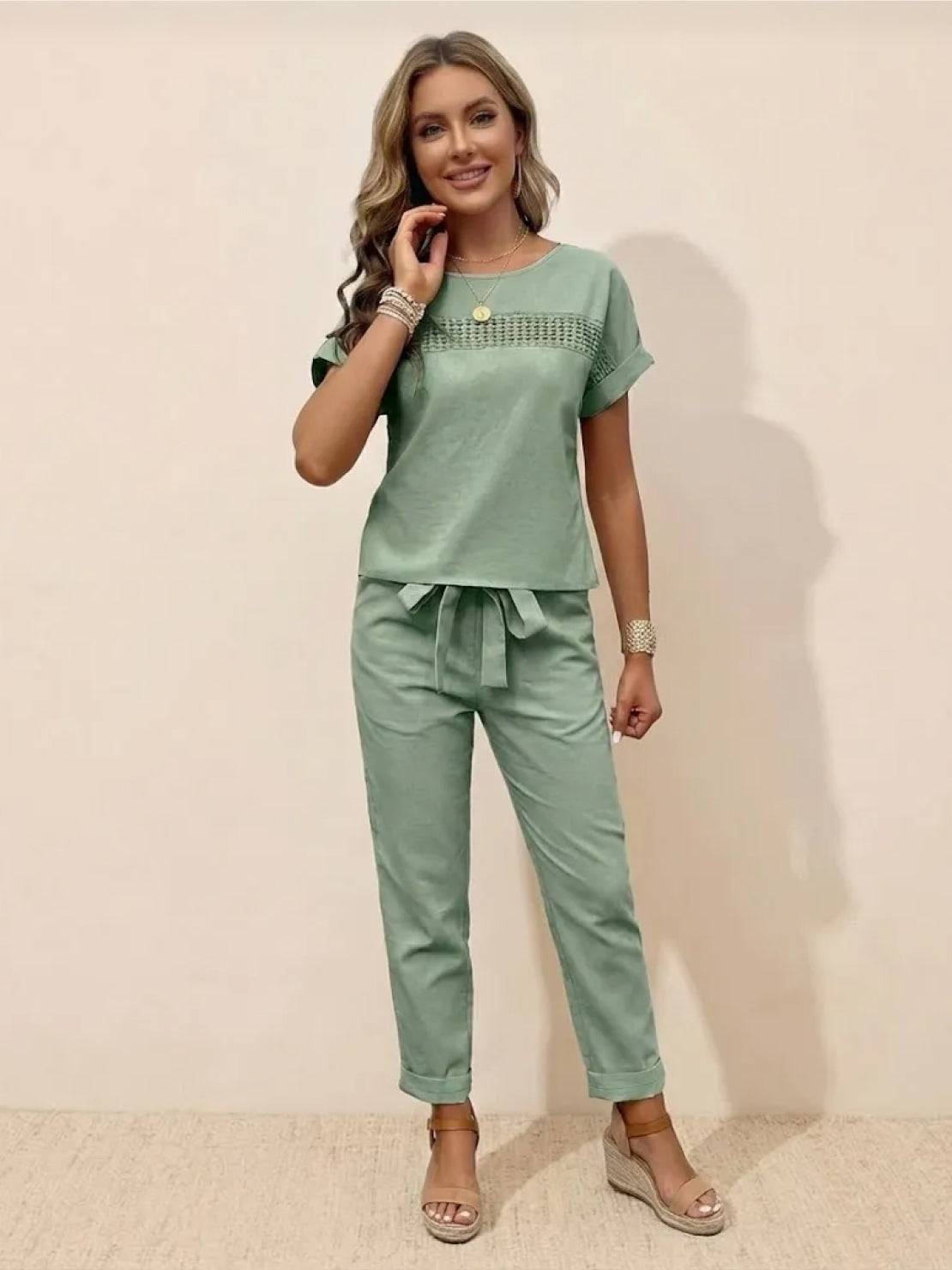 woman wearing light green 100% cotton total comfort two-piece set with short sleeves and drawstring pants