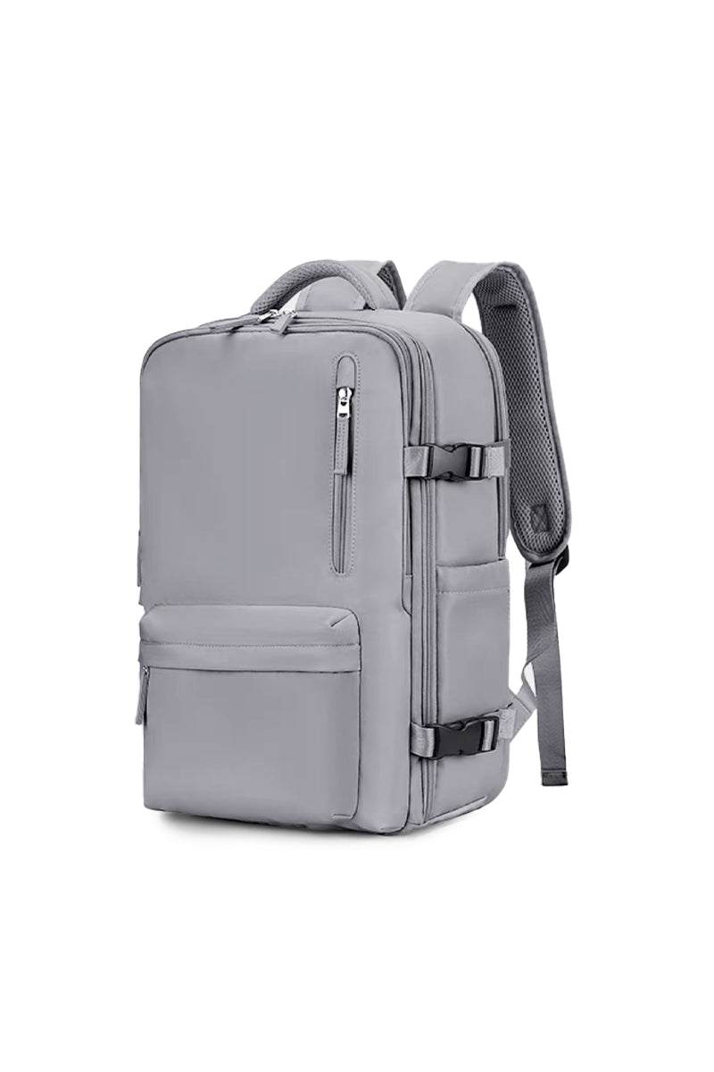 Chic Wanderlust Waterproof Backpack in grey with multiple compartments, ergonomic padded straps, and durable waterproof fabric for versatile travel and daily use.