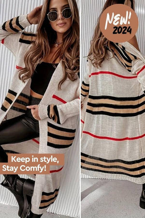 Woman wearing cozy striped long knitted cardigan with black, beige, and red horizontal stripes and oversized fit