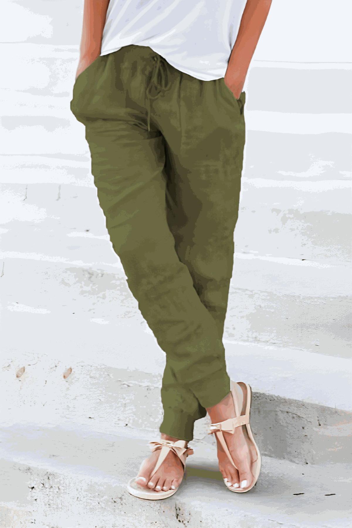 Relaxed Chic Elastic Ankles Pants in olive green with tapered fit and elastic cuffs worn with white top and sandals