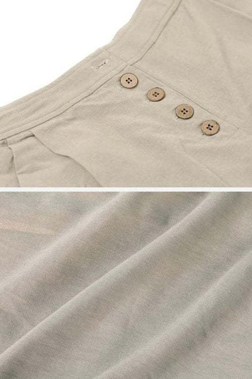 Close-up of beige button front high waist palazzo pants fabric and waistband buttons detail