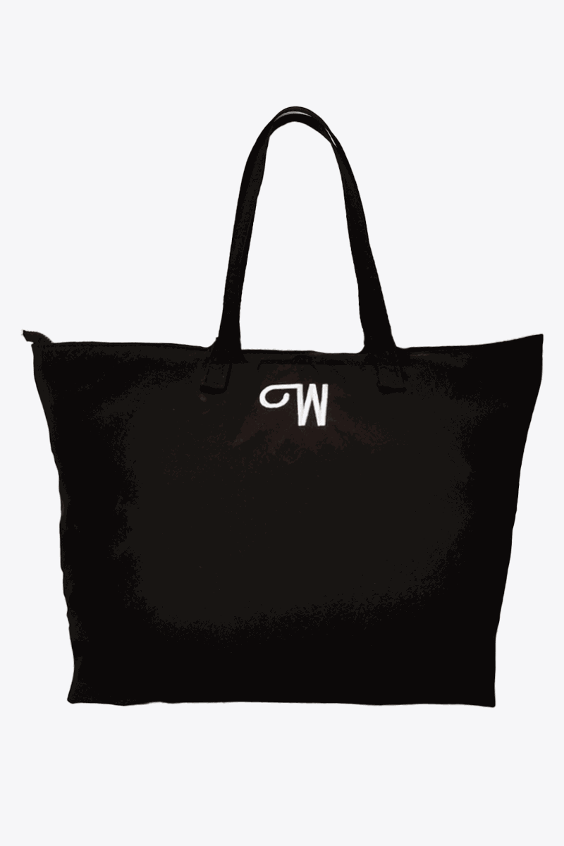 Black waterproof travel bag with sturdy handles and spacious interior for versatile packing