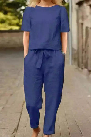 Woman wearing blue cotton-linen blend monochrome two-piece set with relaxed fit on city street