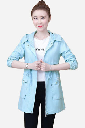 Light blue Cityscape Comfort Hooded Windbreaker with mid-length cut and casual style on woman