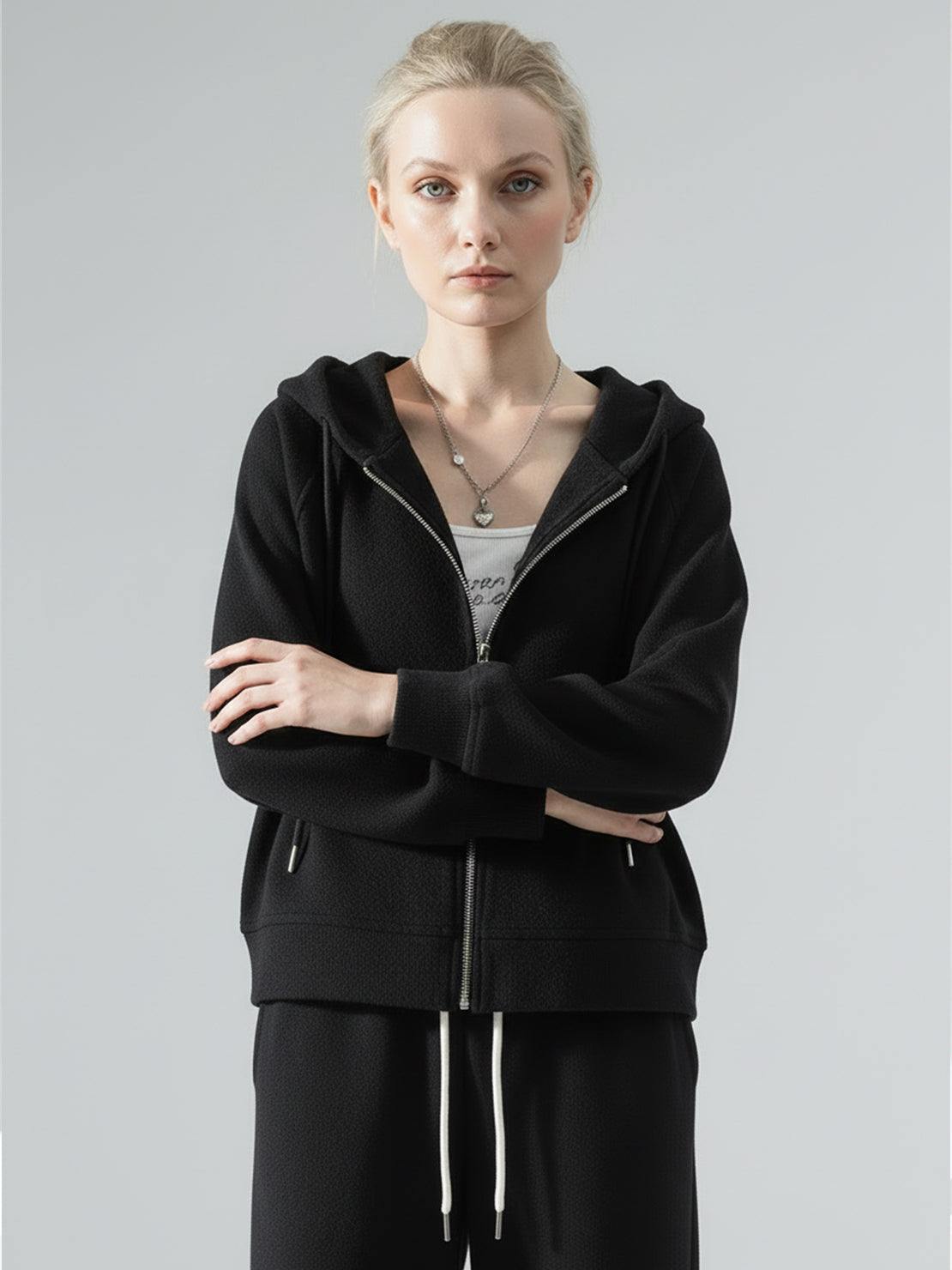 Women wearing chenille zip-up hoodie and wide-leg pants loungewear set in soft fabric with subtle sheen