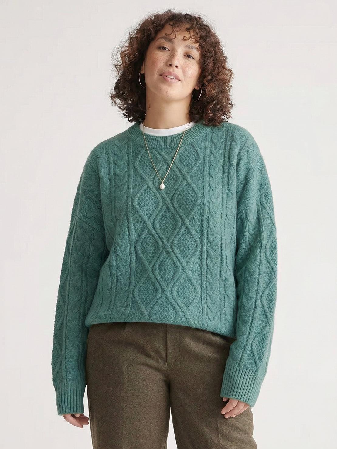 Oversized cable-knit crewneck sweater with dropped shoulders and ribbed trims in thick plush fabric