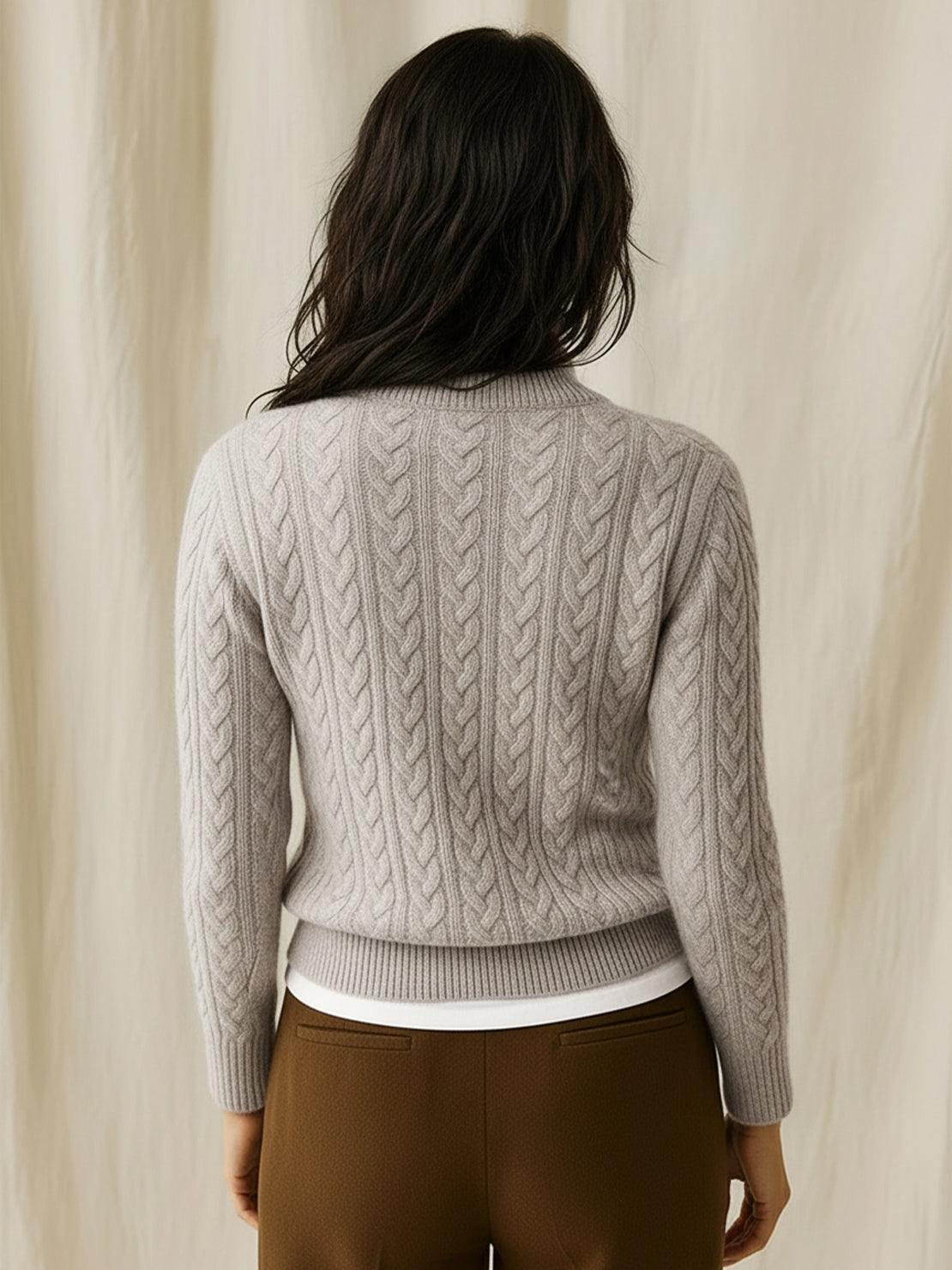 100% wool cable-knit sweater with slim fit and stand collar buttons up for warmth