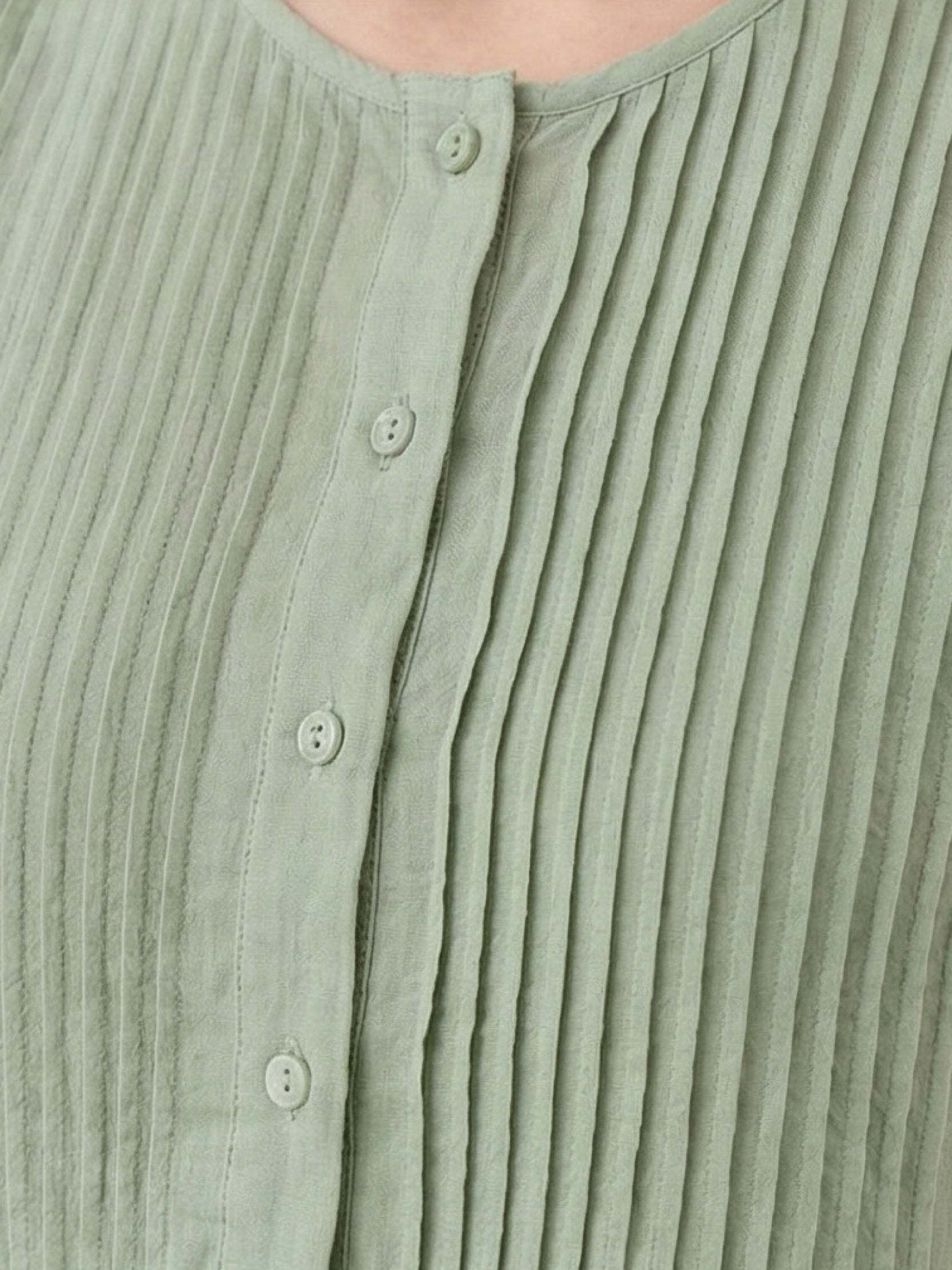 Sleeveless cotton linen pleated midi dress with pintuck bodice and full A-line skirt in white