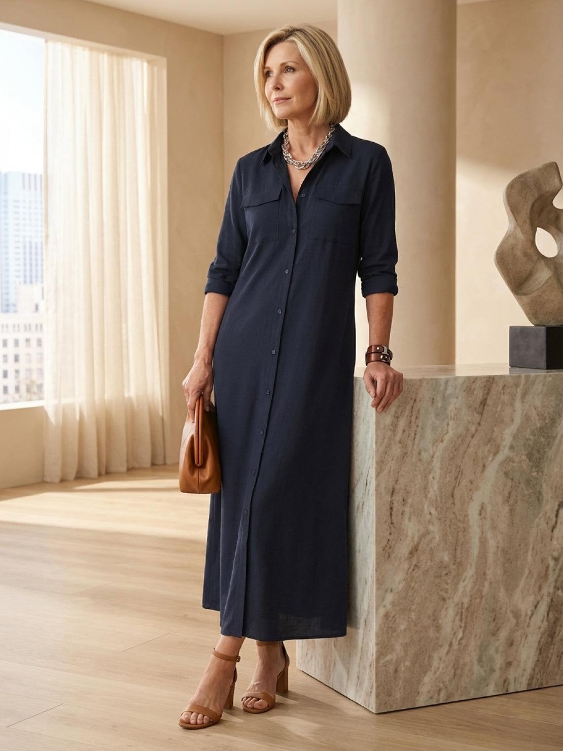 Wrinkle-free maxi shirt dress with point collar, chest pockets, long roll-up sleeves, and side slits for movement