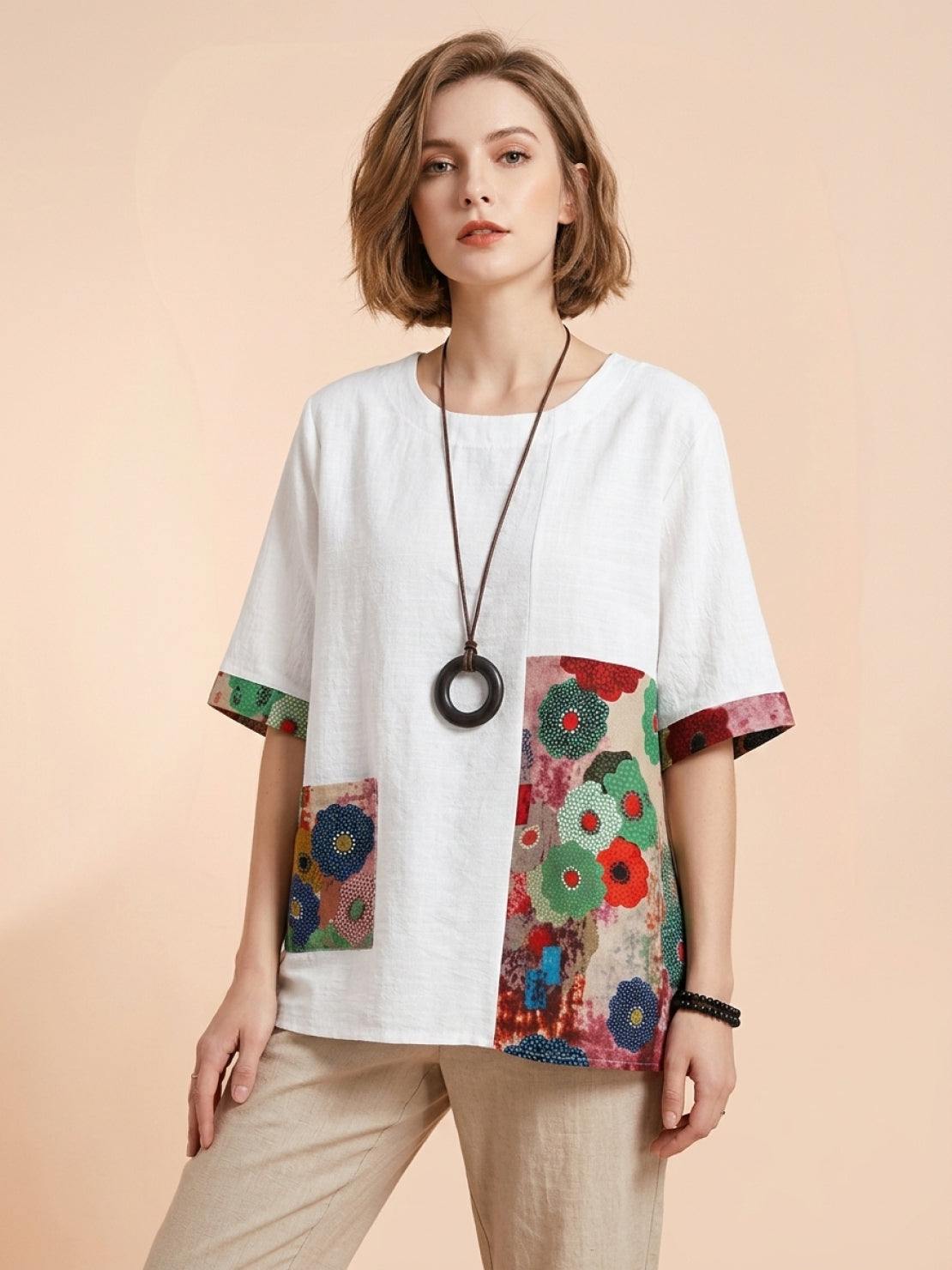 Oversized cotton linen shirt with round neckline, elbow sleeves, and floral patchwork panel