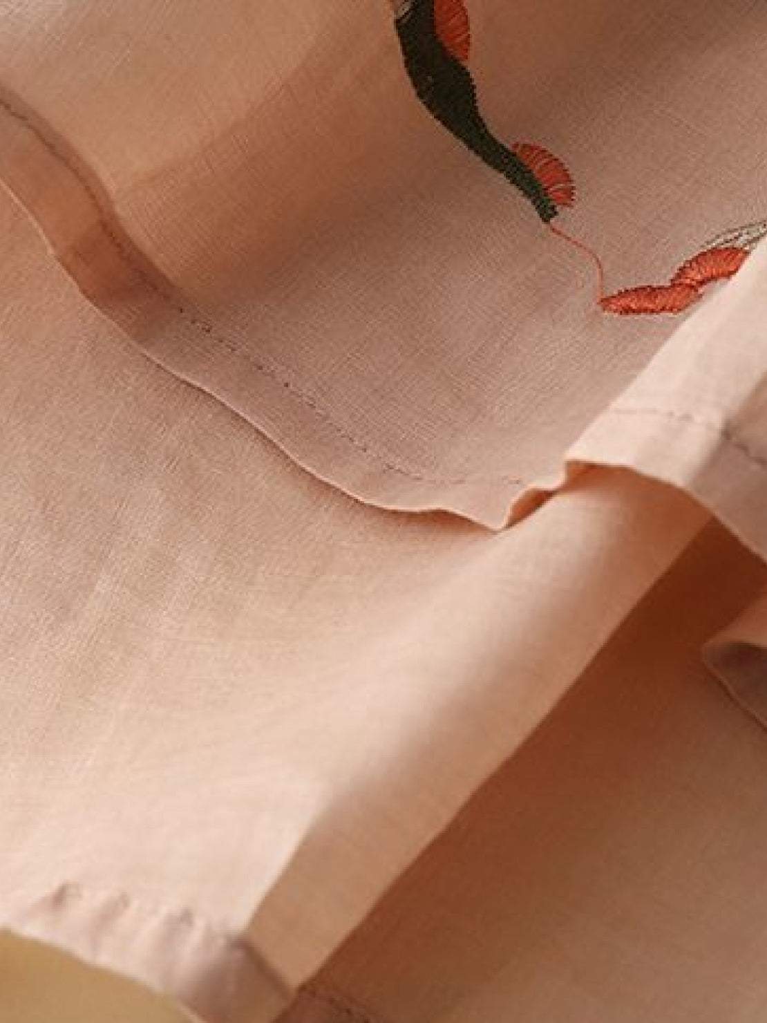 100% cotton linen hand-embroidered shirt with 3/4 flared sleeves and asymmetric hem