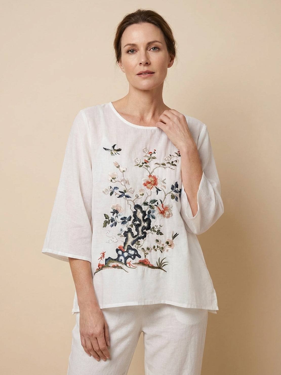 100% cotton linen hand-embroidered shirt with 3/4 flared sleeves and asymmetric hem