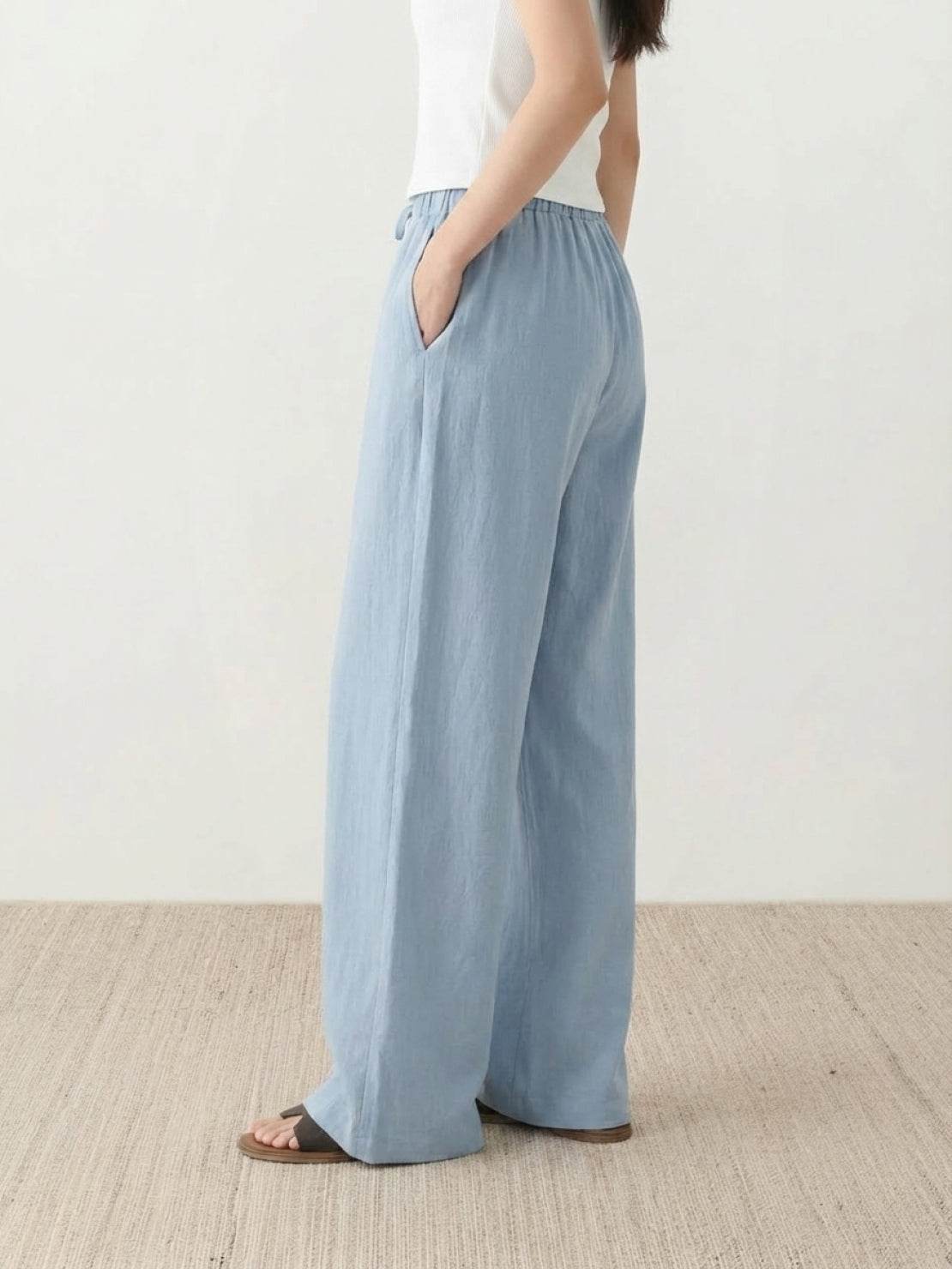 100% linen wide-leg pants with high-rise elastic waistband and side pockets
