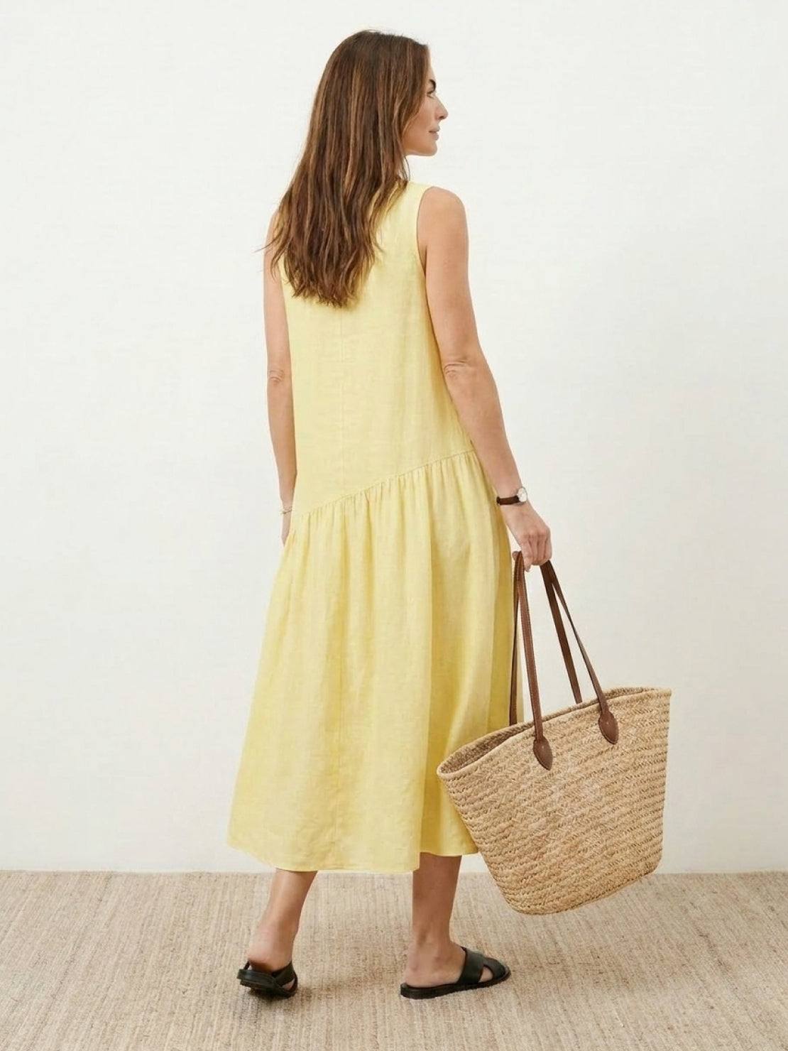 Lightweight cotton-linen summer midi dress with tiered skirt and relaxed drop-waist silhouette in soft neutral color
