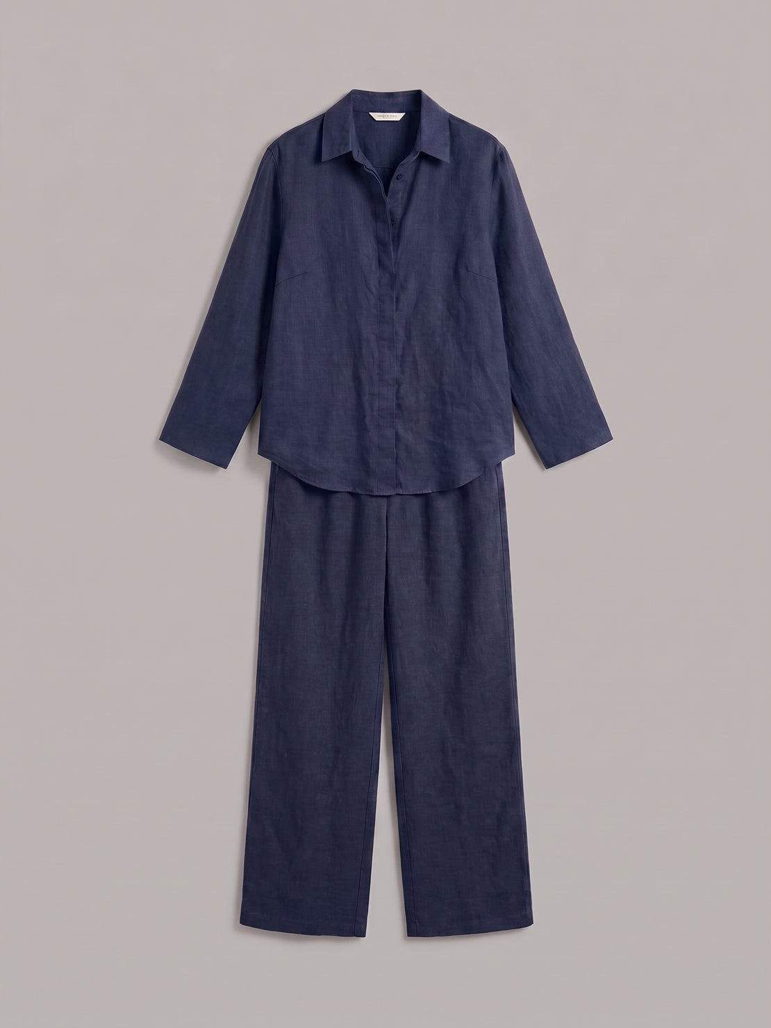 Woman wearing oversized 100% cotton shirt and wide-leg pants co-ord set in relaxed fit
