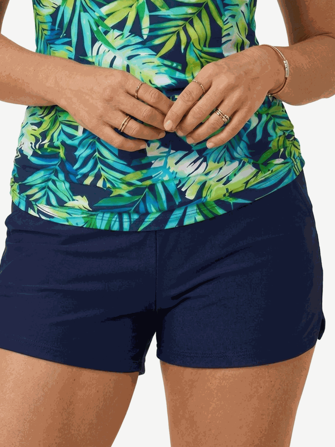 High-neck ruched tankini set with printed top and solid bottom, side ruching, and built-in shelf bra.
