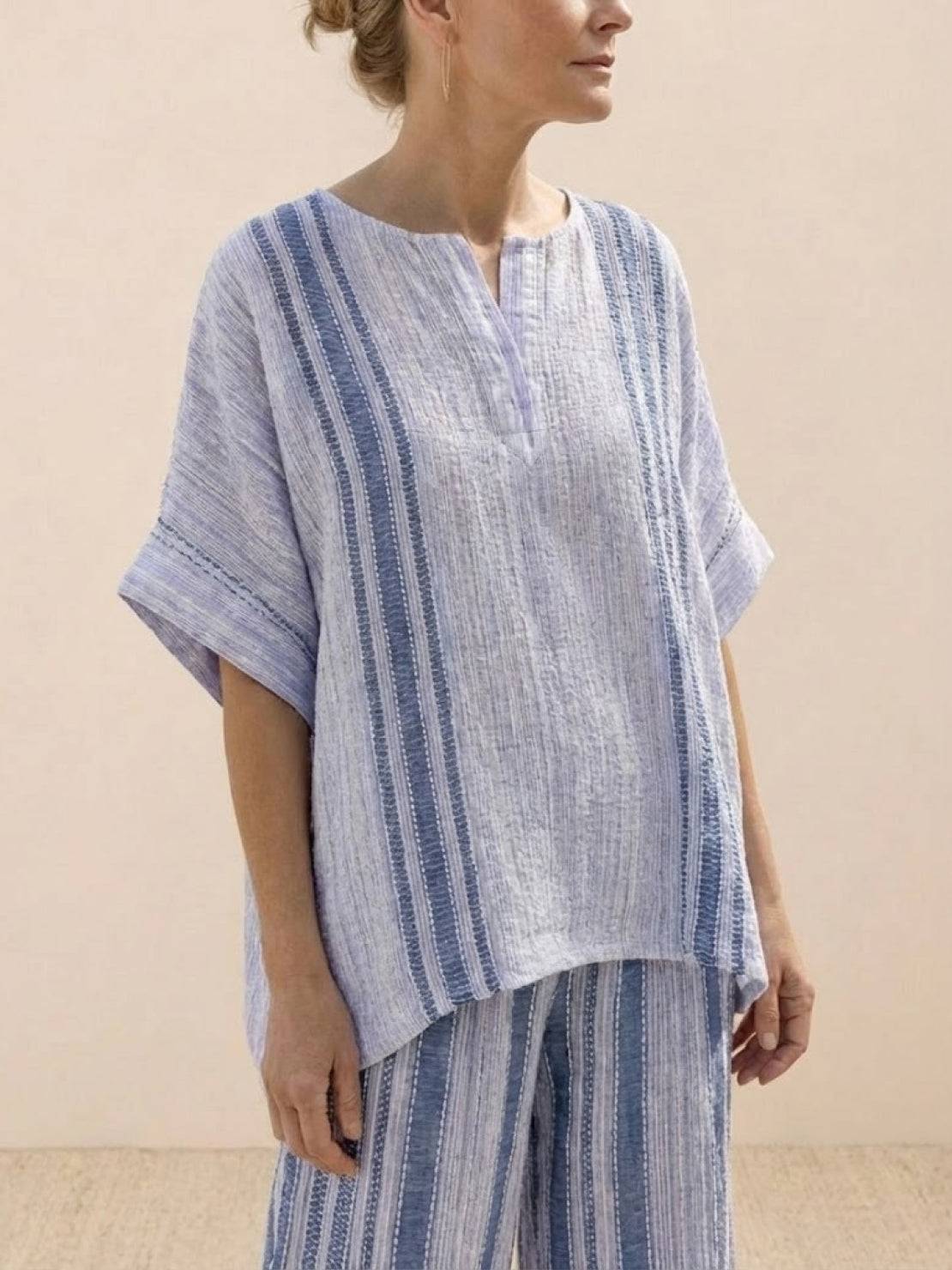 Coastal Comfort Linen two-piece set with artisan crochet, breathable fabric, and relaxed fit for elegant coastal style