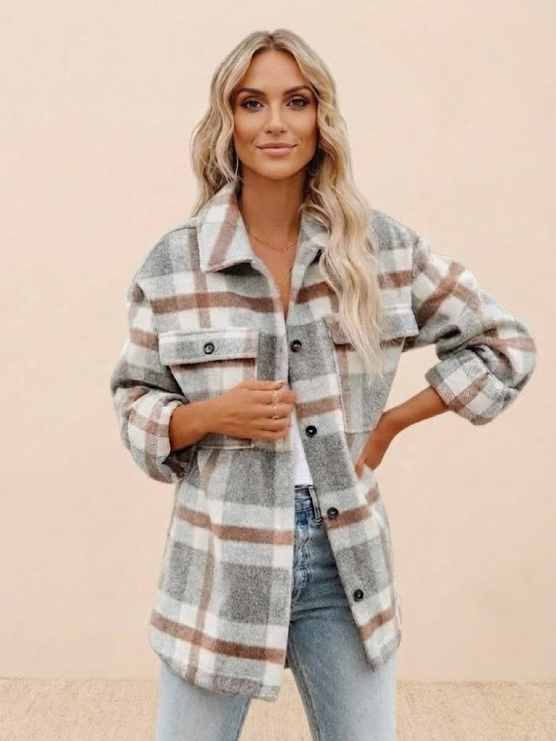 Woman wearing comfy flannel classic button-down shirt in beige, gray, and brown plaid pattern