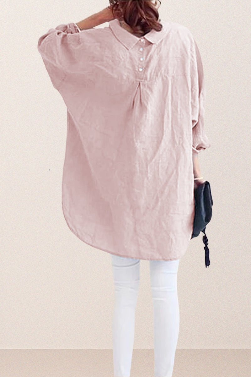 woman wearing oversized linen shirt in sun-washed pink with back button details and relaxed fit