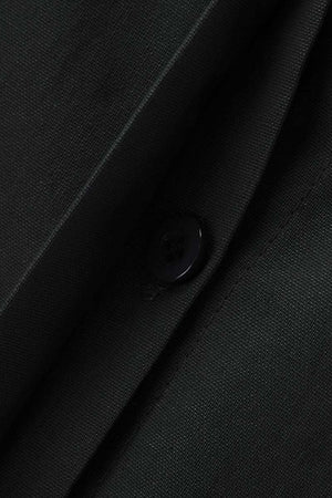 Close-up of oversized 100% cotton black shirt fabric with button detail