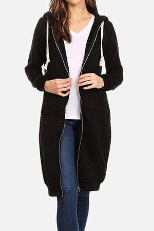 woman wearing black oversized long zip sweatshirt hoodie with hood and front pockets