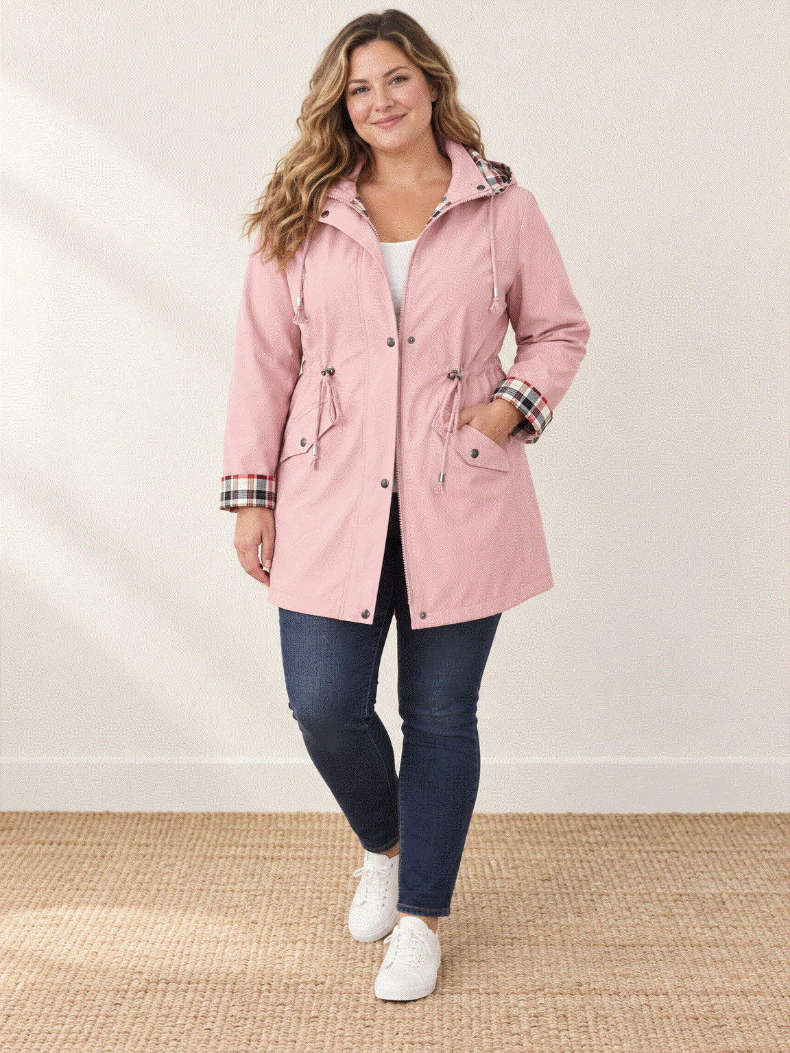 Plaid-lined hooded rain jacket with waterproof shell and drawstring waist