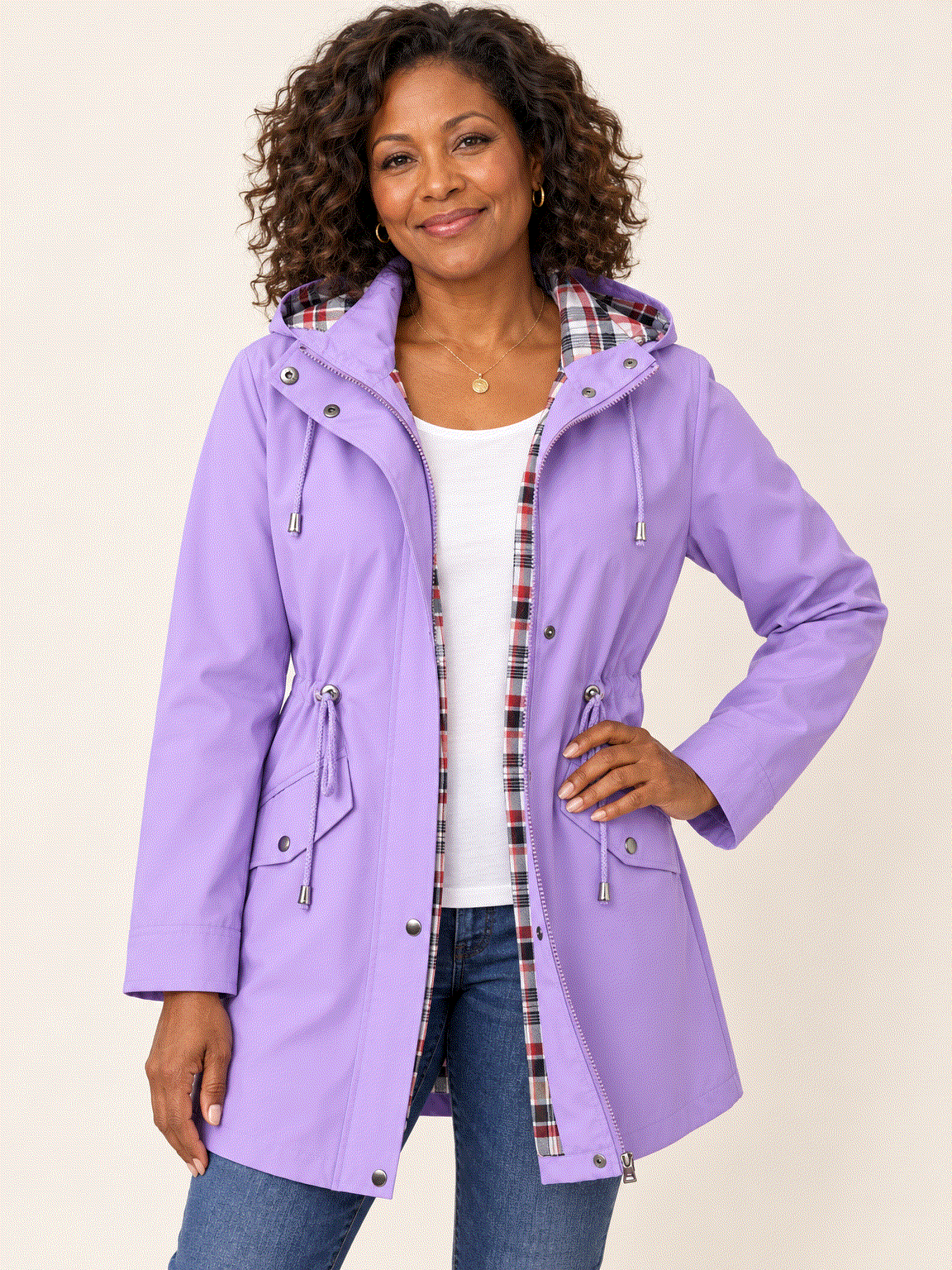 Women's plaid-lined hooded rain jacket with waterproof shell and adjustable drawstring waist