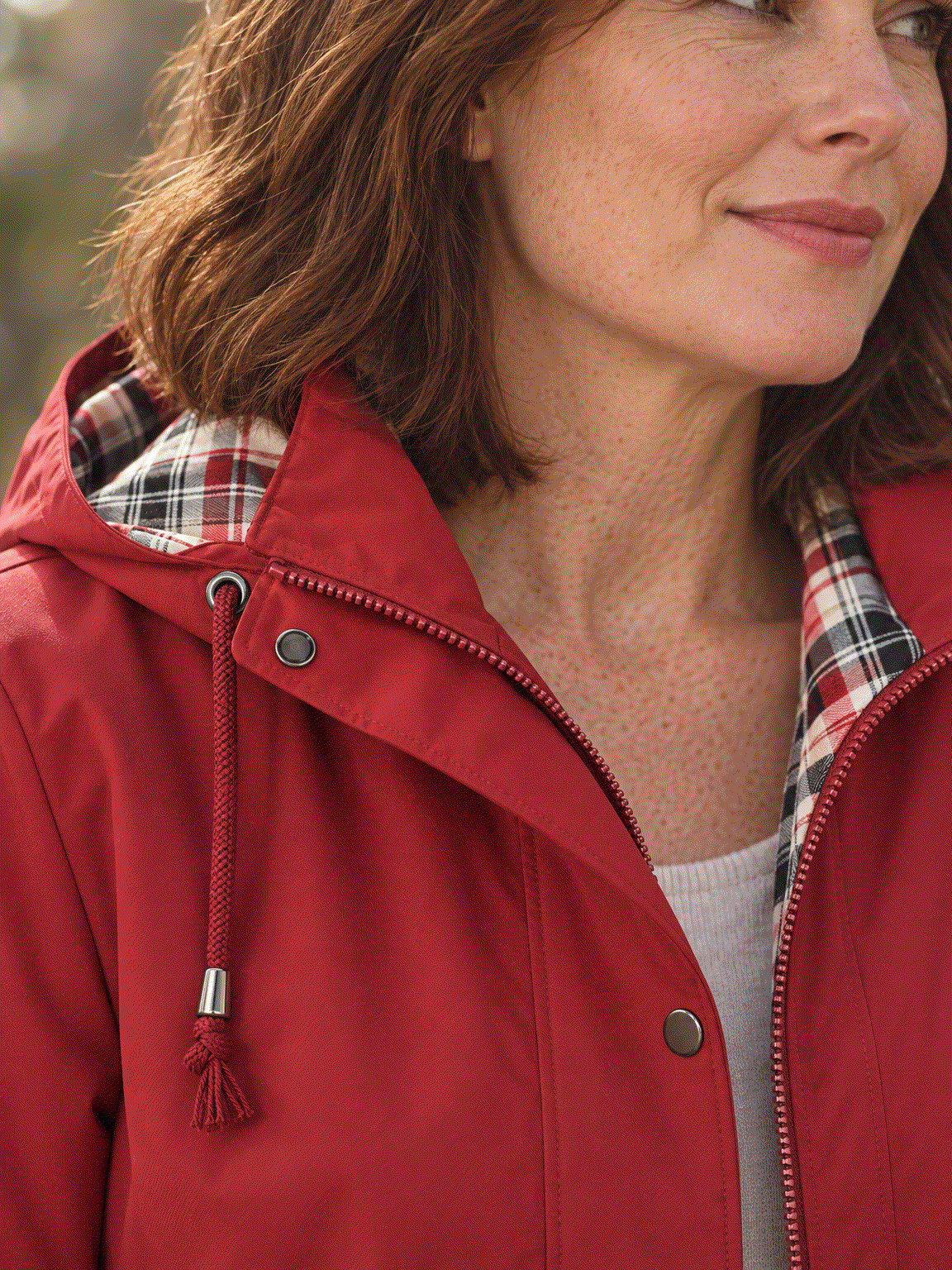 women's plaid-lined hooded rain jacket with waterproof shell and drawstring waist