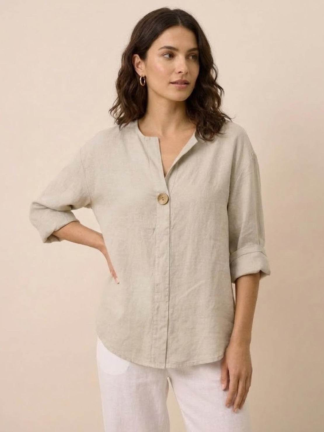white pure linen age-defying button detail shirt on mannequin with folded collar