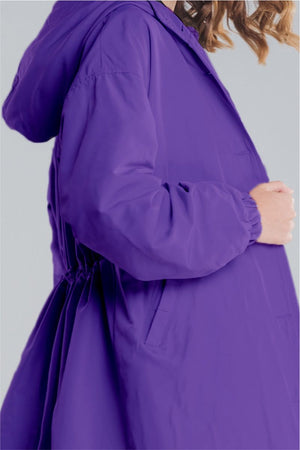 Purple oversized Rain Couture Windbreaker with adjustable waist and hood, water-resistant polyester jacket.