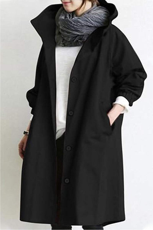 Black oversized Rain Couture Windbreaker with button closure and adjustable hood, stylish water-resistant jacket for women.