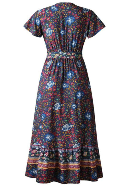 Back view of Bohemian floral print wrap dress with short sleeves and ruffle skirt on dark fabric