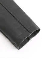 Close-up of sleeve detail on slim fit leather motorcycle jacket