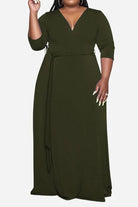 Elegant plus size dress with belt, deep V-neck, and 3/4 sleeves in solid color
