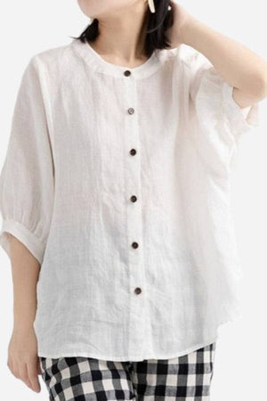 Relaxed loose breathable white linen blouse with button-down front and half sleeves