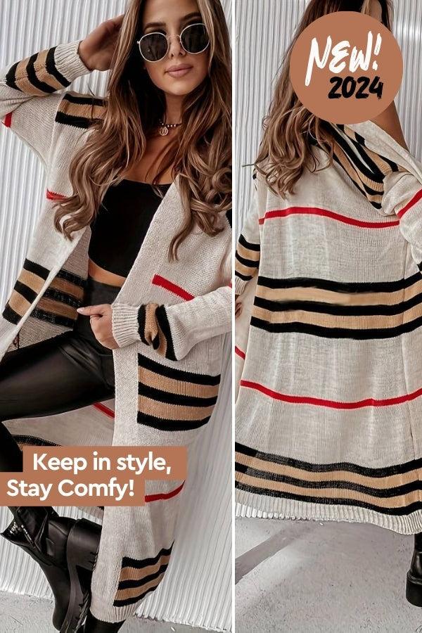 Woman wearing cozy striped long knitted cardigan with black, beige, and red horizontal stripes and oversized fit