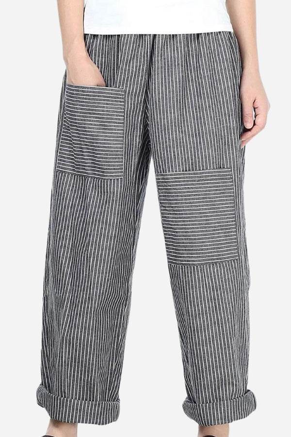 High waist striped comfort pants with large patch pockets and rolled cuffs on a female model