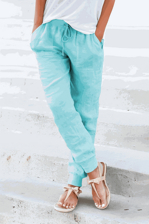 Light blue relaxed chic elastic ankles pants with drawstring waist and tapered cuffs, styled with casual sandals