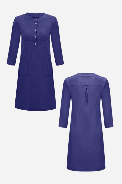 Blue cotton dress with 3/4 sleeves, half-button front, and practical pockets, shown front and back view