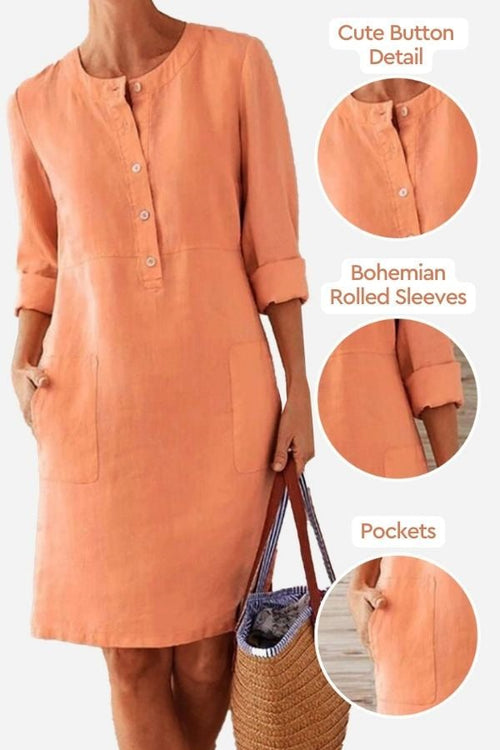 Orange cotton dress with cute button detail, bohemian rolled 3/4 sleeves, and practical pockets.