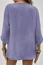 Back view of a lavender breezy button front tunic with rolled sleeves and crinkled bohemian fabric style