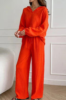 Women’s bright orange cotton collared two-piece set with bishop sleeves and loose fit pants