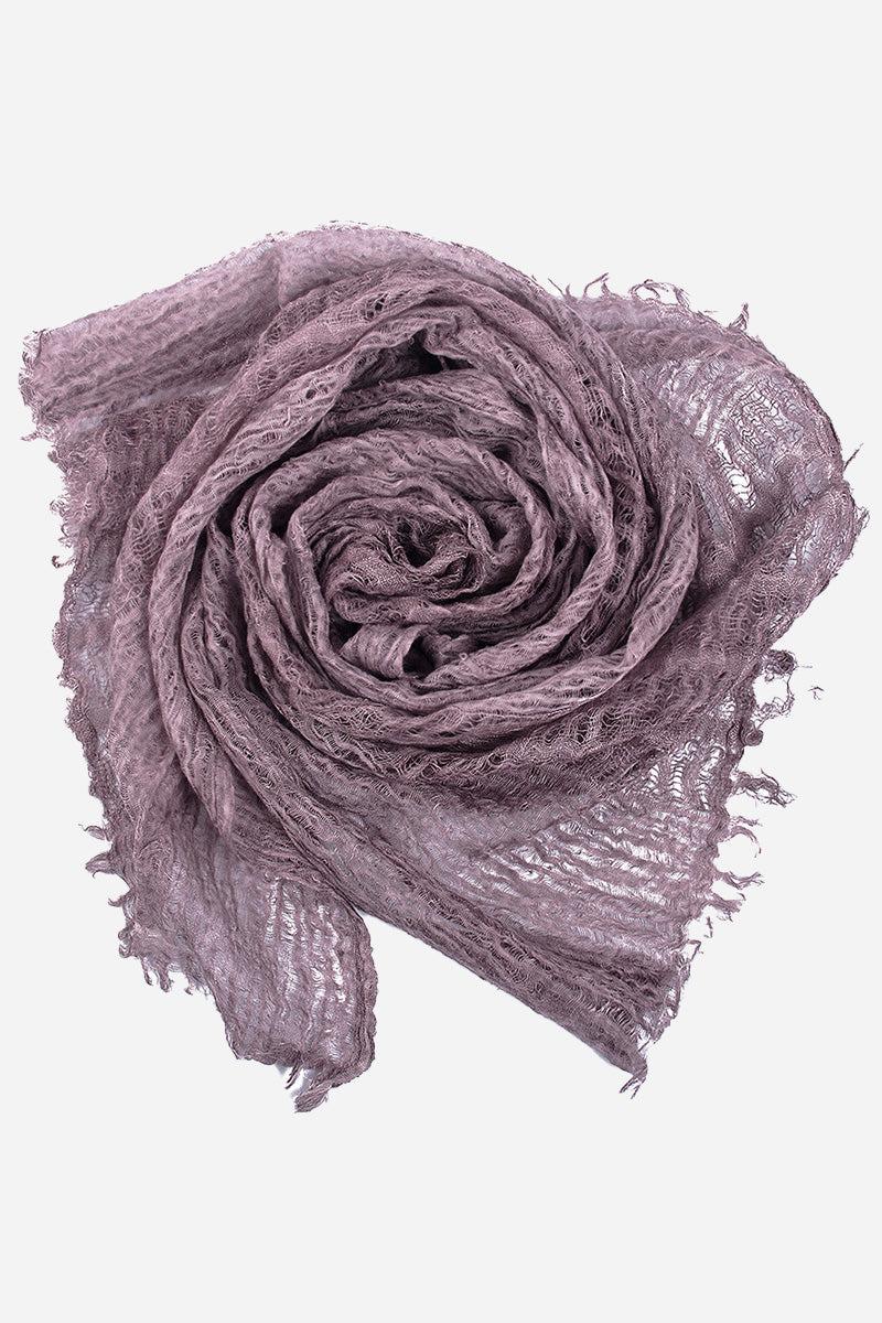 Lightweight linen scarf in lavender with frayed edges, breathable and versatile wrap accessory.