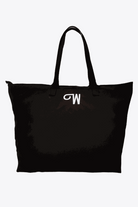 Black waterproof travel bag with sturdy handles and spacious interior for versatile packing