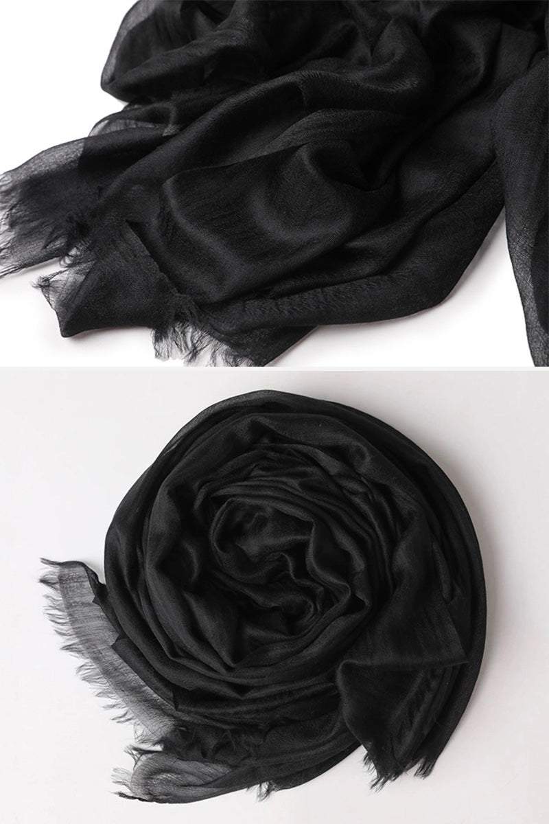 Black 100% cashmere featherlight luxury scarf with soft, lightweight fabric and fringed edges