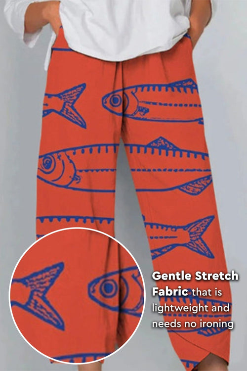 Artistic sardine pattern breathable cropped pants in orange with blue fish design and gentle stretch fabric