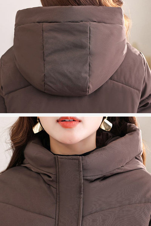 Close-up of brown Everyday Warmth Coat hood and collar showing insulated, wind-resistant fabric and padded design.