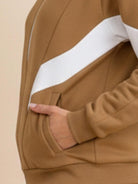 Women wearing Colorblock Comfort Tracksuit with contrast curved panels and relaxed fit