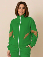 Colorblock comfort tracksuit with contrast curved panels, stand collar jacket, and relaxed straight-leg pants in wrinkle-resistant fabric